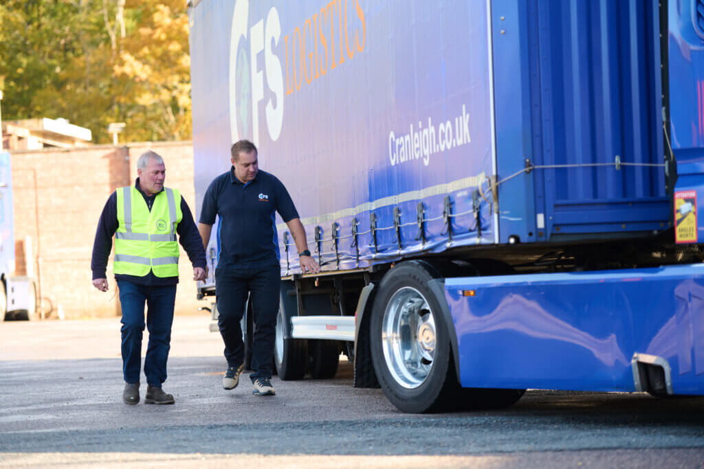 Driver checking truck