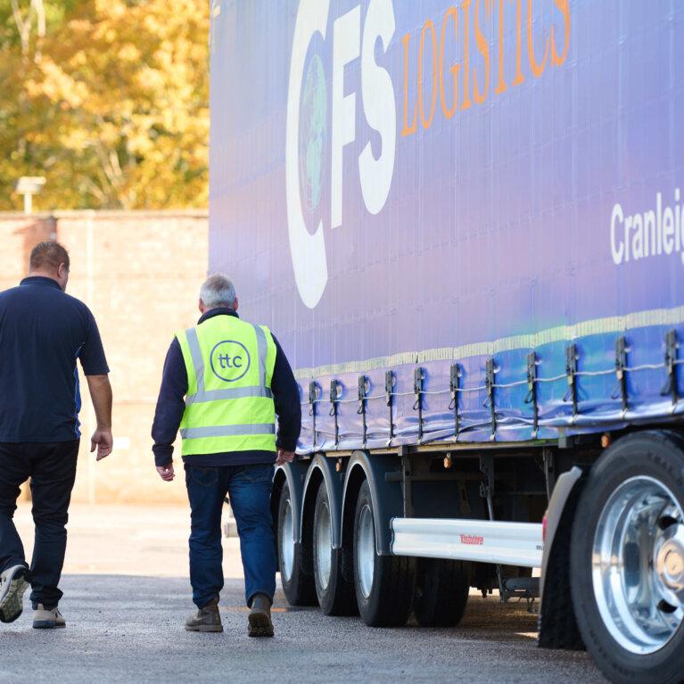 Driver checking truck