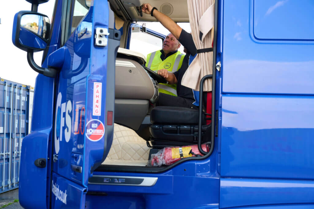 Driver checking truck