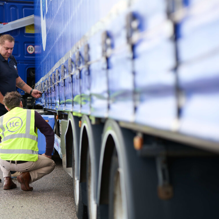Driver checking truck