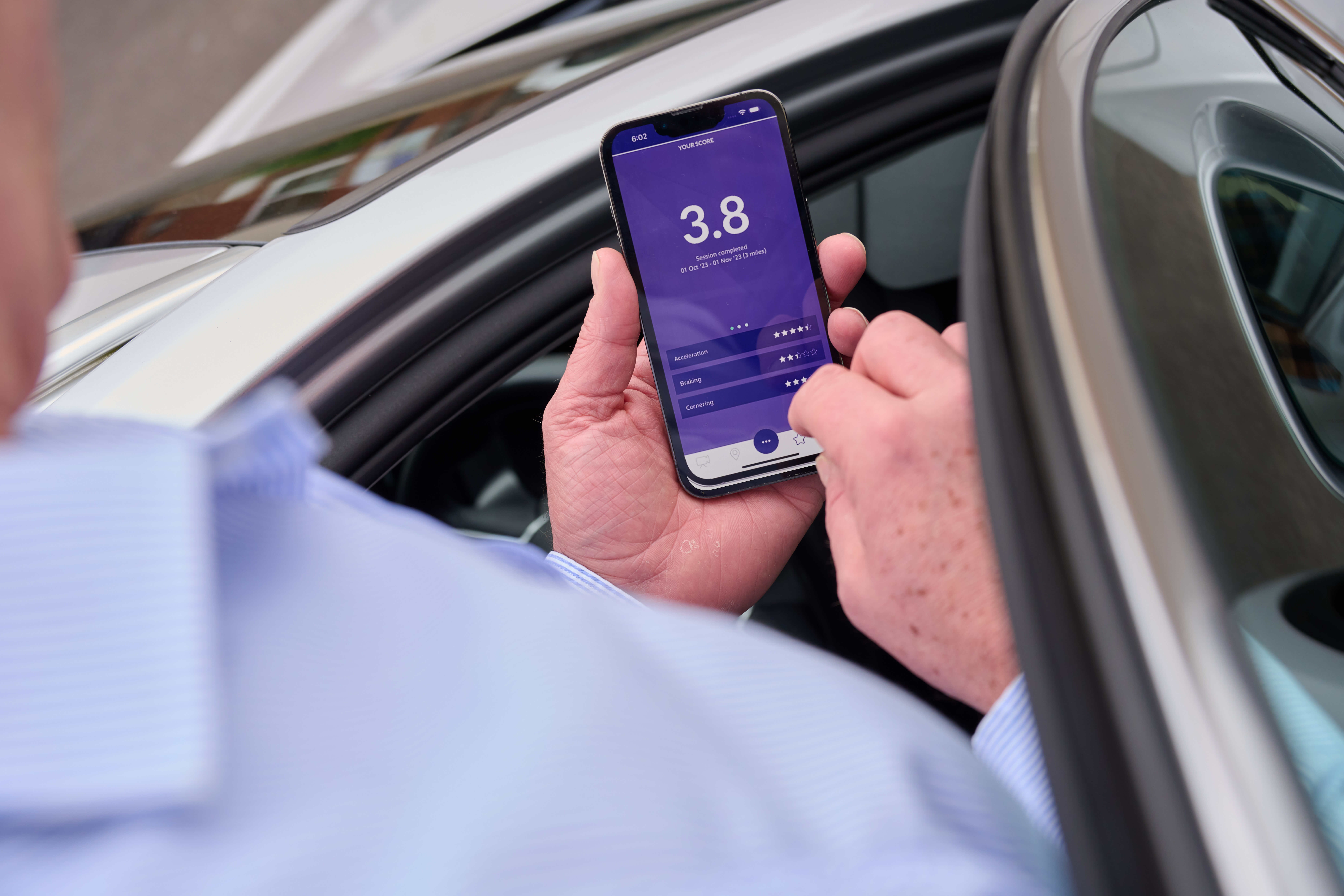 Driver checking phone app