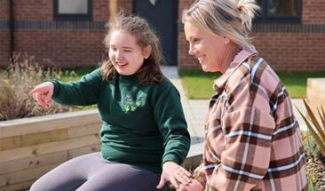 Adult and child sitting down