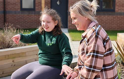 Adult and child sitting down