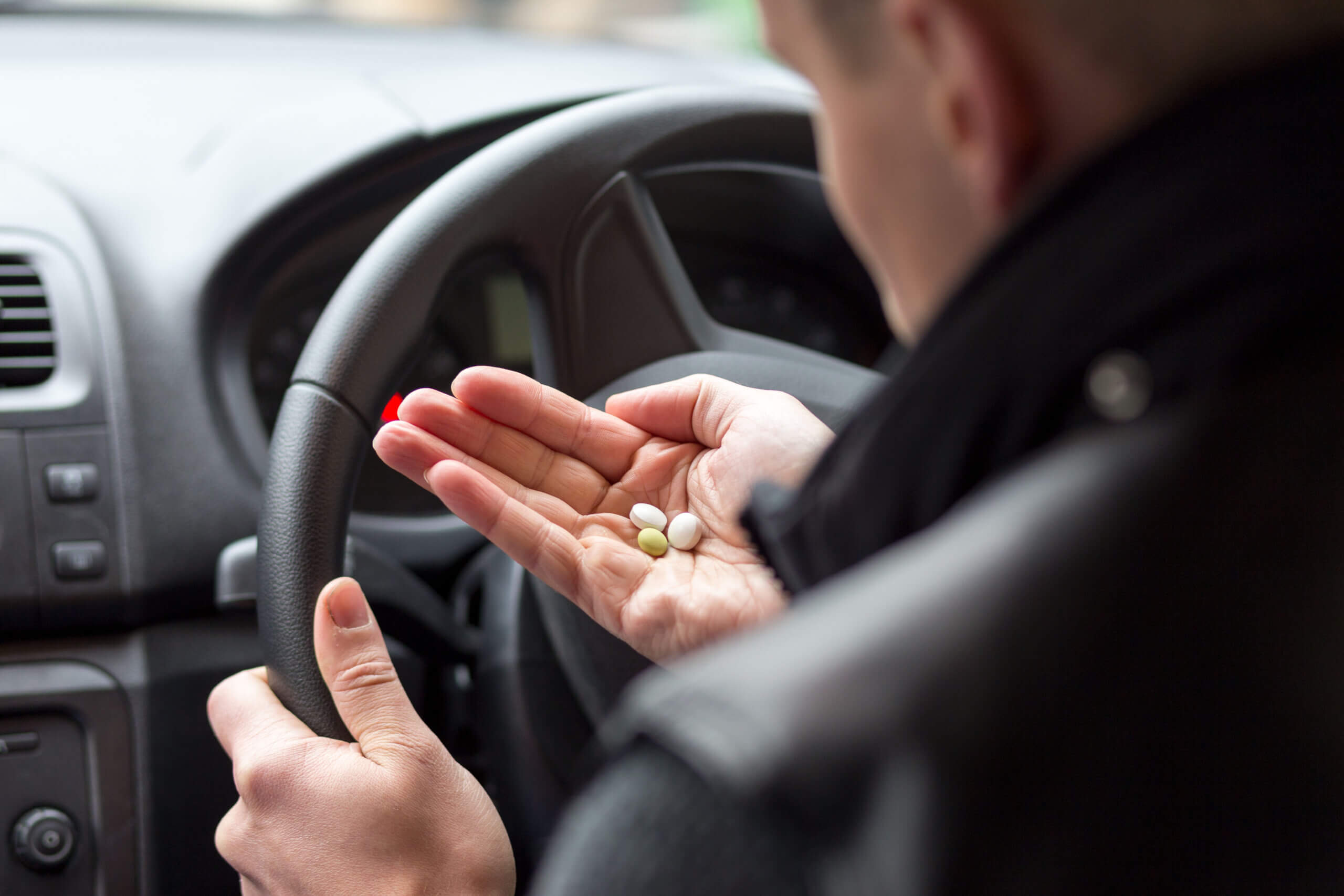 Man taking drugs in the car