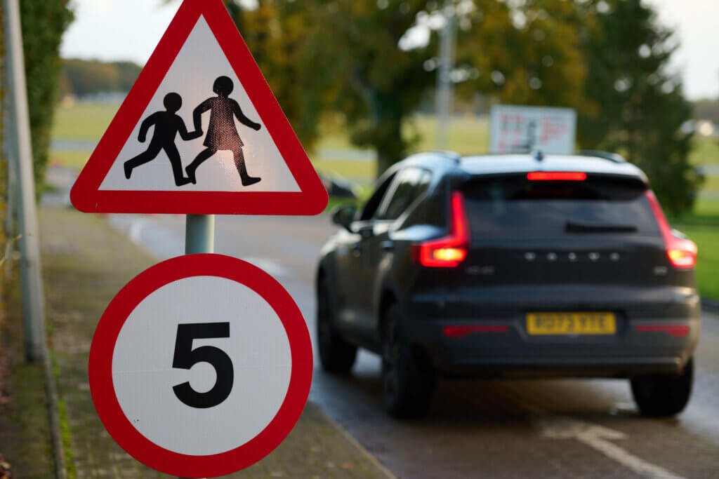 car with school sign 5mph