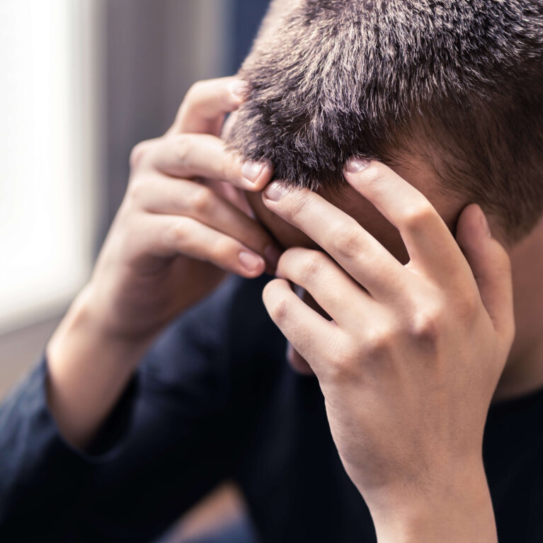 Man with head in hands