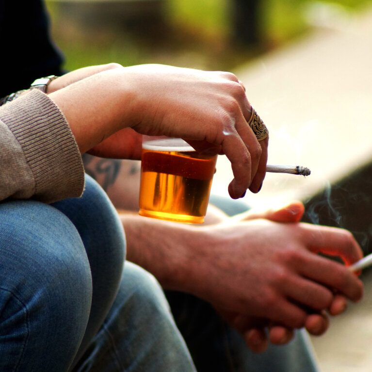 smoking and beer in hand