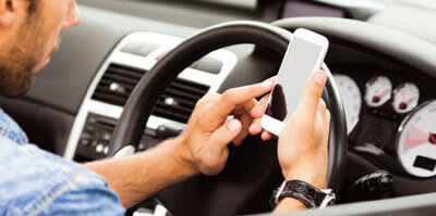 Driver using mobile phone in car