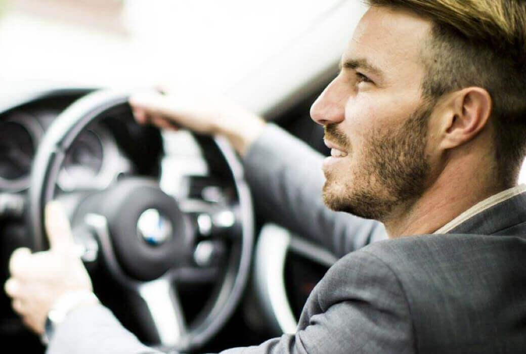 Businessman looking up while driving