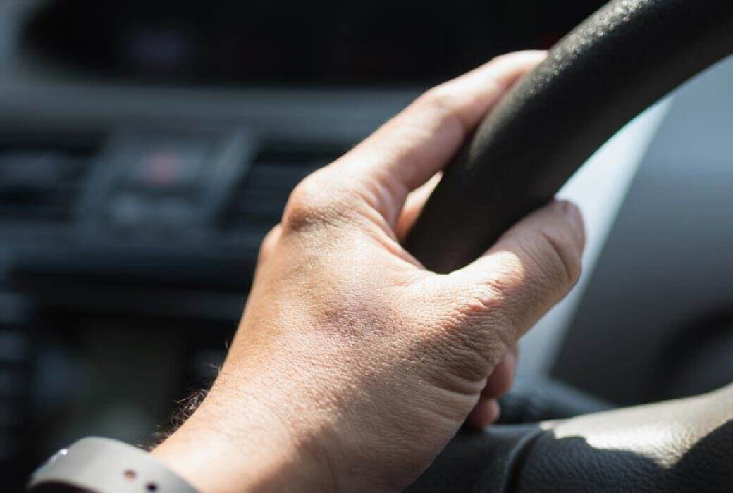 Close-up of driver's hand