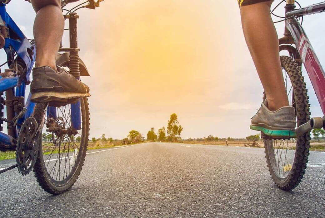 Closeup of 2 people cycling