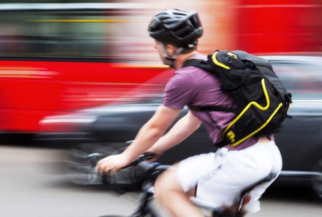 Cyclist travelling in heavy traffic