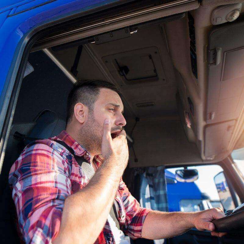 Truck driver tired yawning
