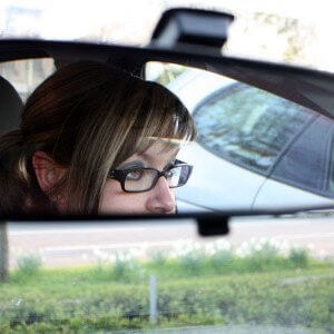 Lady in rear view mirror